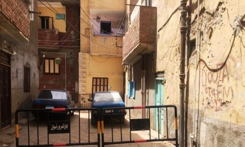 حجر عمارتين سكنيتين في أسوان بعد ظهور حالات مصابة بكورونا